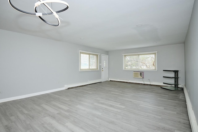 212A Collen Dr Unit 104, Lombard, IL 60148 - interior space featuring baseboards, a baseboard radiator, a wall unit AC, and wood finished floors