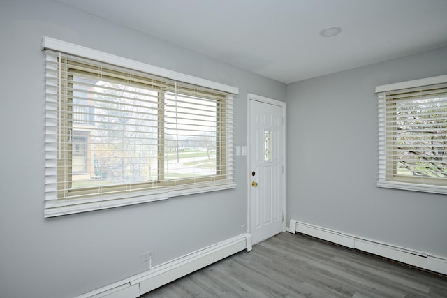 212A Collen Dr Unit 104, Lombard, IL 60148 - entrance foyer with a baseboard radiator, wood finished floors, and baseboards