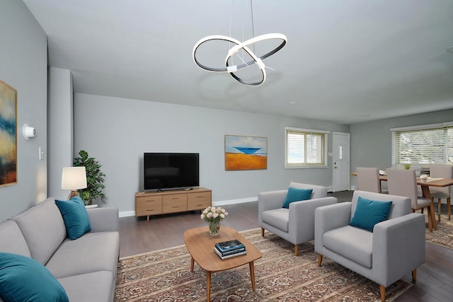 212A Collen Dr Unit 104, Lombard, IL 60148 - living area featuring baseboards, an inviting chandelier, and wood finished floors