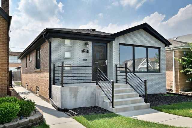 5628 S Merrimac Ave, Chicago, IL 60638 - view of front of property featuring brick siding and a gate