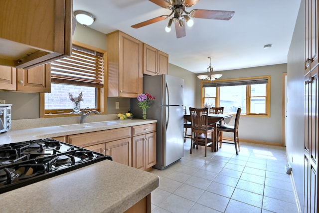 5628 S Merrimac Ave, Chicago, IL 60638 - kitchen with freestanding refrigerator, light countertops, light tile patterned floors, ceiling fan, and light brown cabinets