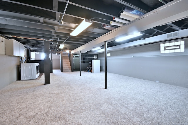 5628 S Merrimac Ave, Chicago, IL 60638 - basement featuring stairs, washer / dryer, and carpet