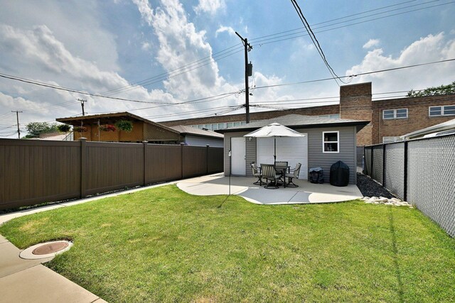 5628 S Merrimac Ave, Chicago, IL 60638 - rear view of house featuring a fenced backyard and a patio