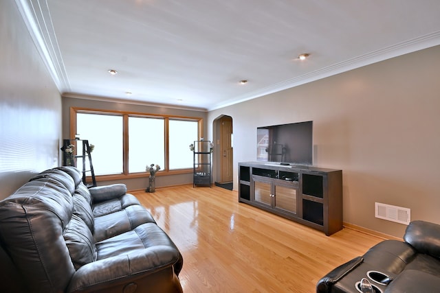 5628 S Merrimac Ave, Chicago, IL 60638 - living area featuring arched walkways, crown molding, and light wood finished floors