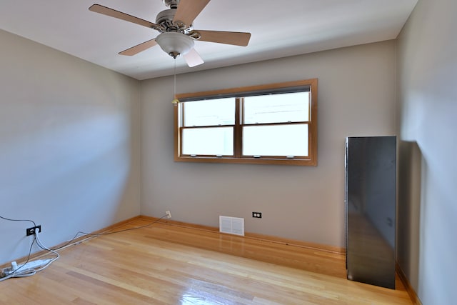 5628 S Merrimac Ave, Chicago, IL 60638 - empty room featuring wood finished floors and a ceiling fan