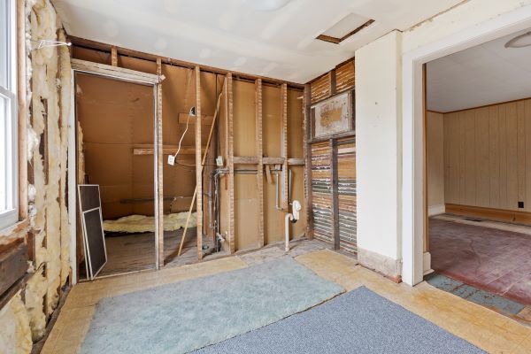 miscellaneous room featuring wooden walls