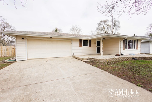 13 Park Pl, Kankakee, IL 60901 - ranch-style home featuring fence, a garage, and driveway