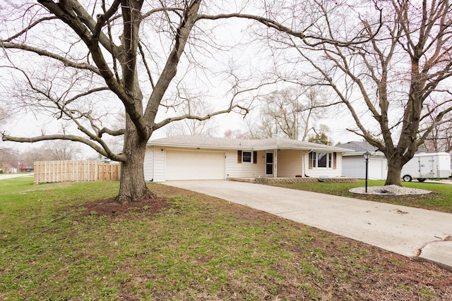 13 Park Pl, Kankakee, IL 60901 - ranch-style house featuring an attached garage, driveway, fence, and a front lawn