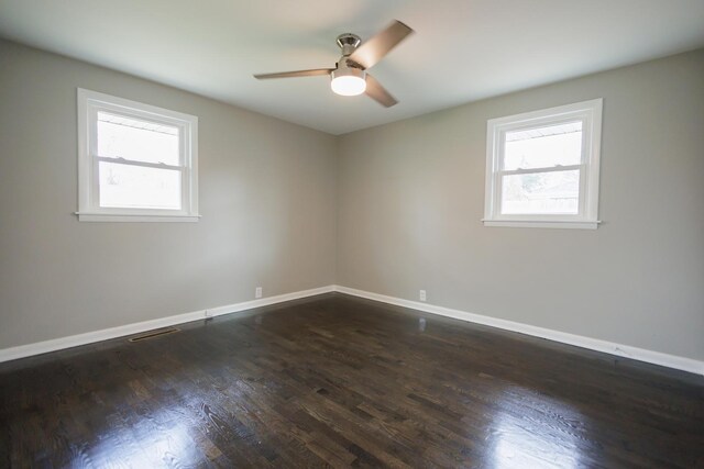 13 Park Pl, Kankakee, IL 60901 - empty room with dark wood finished floors, baseboards, and ceiling fan