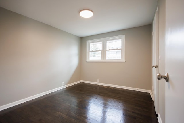 13 Park Pl, Kankakee, IL 60901 - spare room featuring baseboards and dark wood finished floors