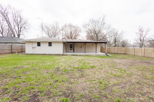 13 Park Pl, Kankakee, IL 60901 - rear view of property with a patio area, a fenced backyard, and a lawn