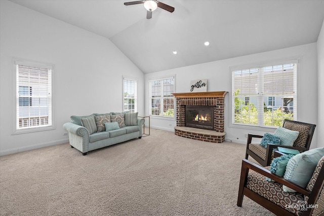 16432 S Harmon Ln, Plainfield, IL 60586 - carpeted living area featuring healthy amount of natural light, baseboards, vaulted ceiling, a brick fireplace, and a ceiling fan