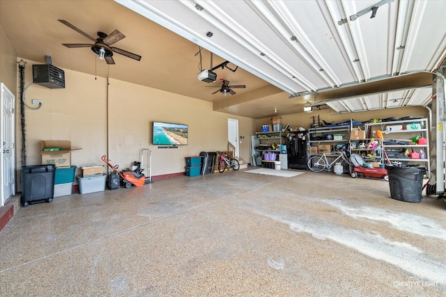 garage featuring a ceiling fan and a garage door opener
