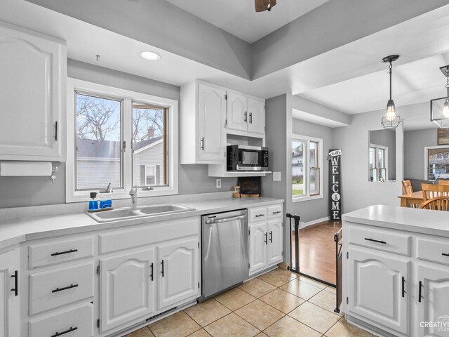 445 S Depot St, Somonauk, IL 60552 - kitchen with appliances with stainless steel finishes, light tile patterned floors, a sink, and white cabinets