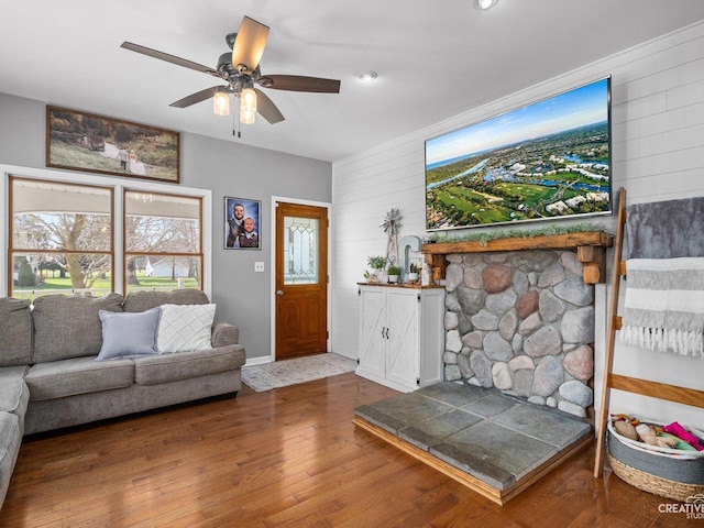 445 S Depot St, Somonauk, IL 60552 - living area with wood walls, a wealth of natural light, a ceiling fan, and wood finished floors