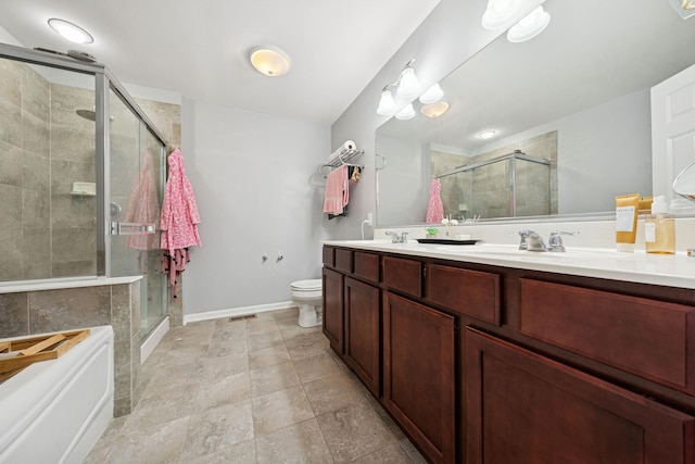 full bathroom featuring double vanity, toilet, a stall shower, a sink, and a bath