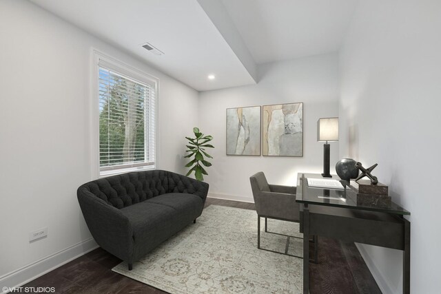 office space with baseboards, recessed lighting, wood finished floors, and visible vents
