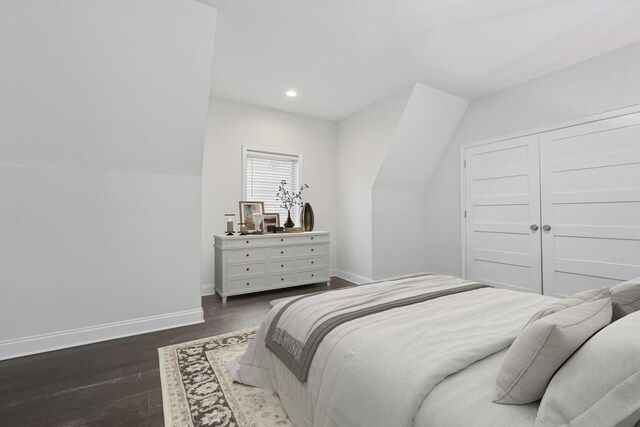 bedroom featuring baseboards, a closet, recessed lighting, and wood finished floors