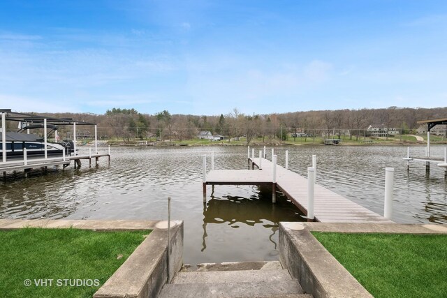 view of dock featuring a view of trees and a water view