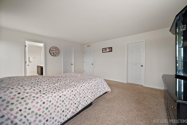 bedroom with baseboards and carpet floors