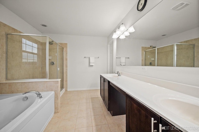 bathroom with a stall shower, a sink, tile patterned flooring, and visible vents