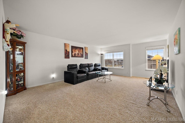 carpeted living room featuring baseboards