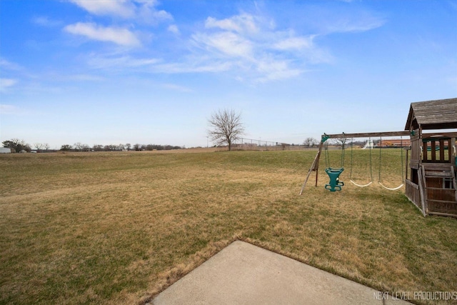 view of yard featuring a playground and a rural view