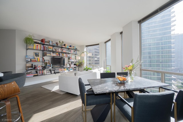 222 N Columbus Dr Unit 1509, Chicago, IL 60601 - dining room featuring a wealth of natural light, wood finished floors, and a wall of windows