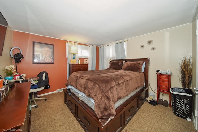 bedroom featuring visible vents and light carpet