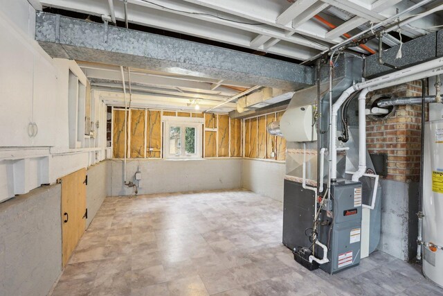 basement featuring water heater and heating unit