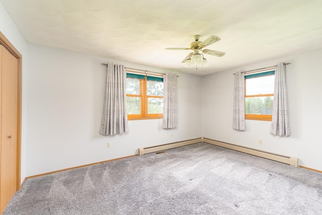 3449 E Cleveland St, Ladd, IL 61329 - unfurnished bedroom featuring carpet, baseboards, a baseboard heating unit, and ceiling fan