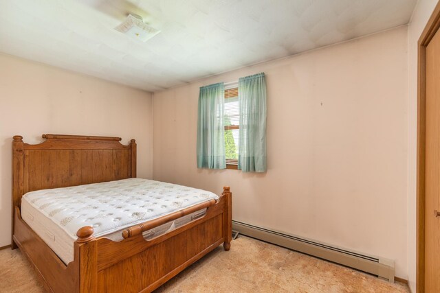 3449 E Cleveland St, Ladd, IL 61329 - bedroom with a baseboard radiator and light colored carpet