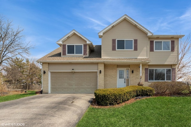 traditional-style home with concrete driveway, brick siding, a front lawn, and a shingled roof