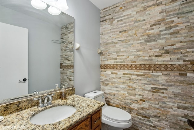 bathroom with toilet and vanity