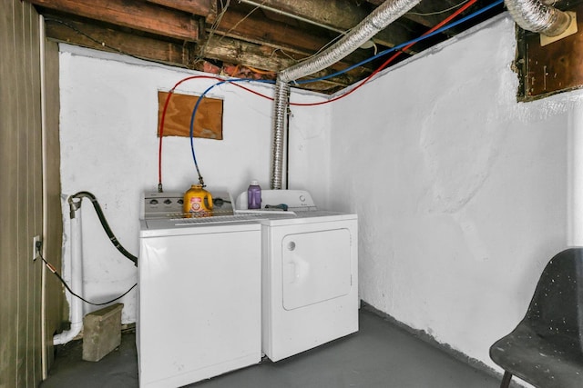 washroom featuring washing machine and dryer and laundry area