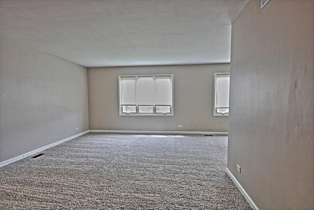 6140 El Morro Ln, Oak Forest, IL 60452 - carpeted empty room with healthy amount of natural light and baseboards