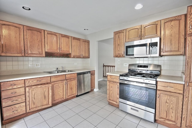 6140 El Morro Ln, Oak Forest, IL 60452 - kitchen with stainless steel appliances, a sink, light countertops, tasteful backsplash, and recessed lighting