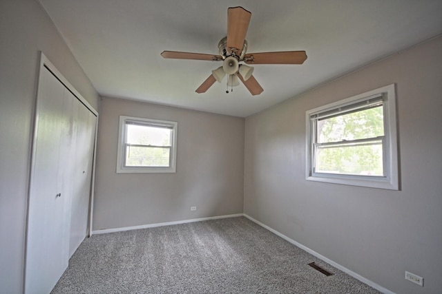 6140 El Morro Ln, Oak Forest, IL 60452 - unfurnished bedroom with a closet, baseboards, carpet flooring, and a ceiling fan