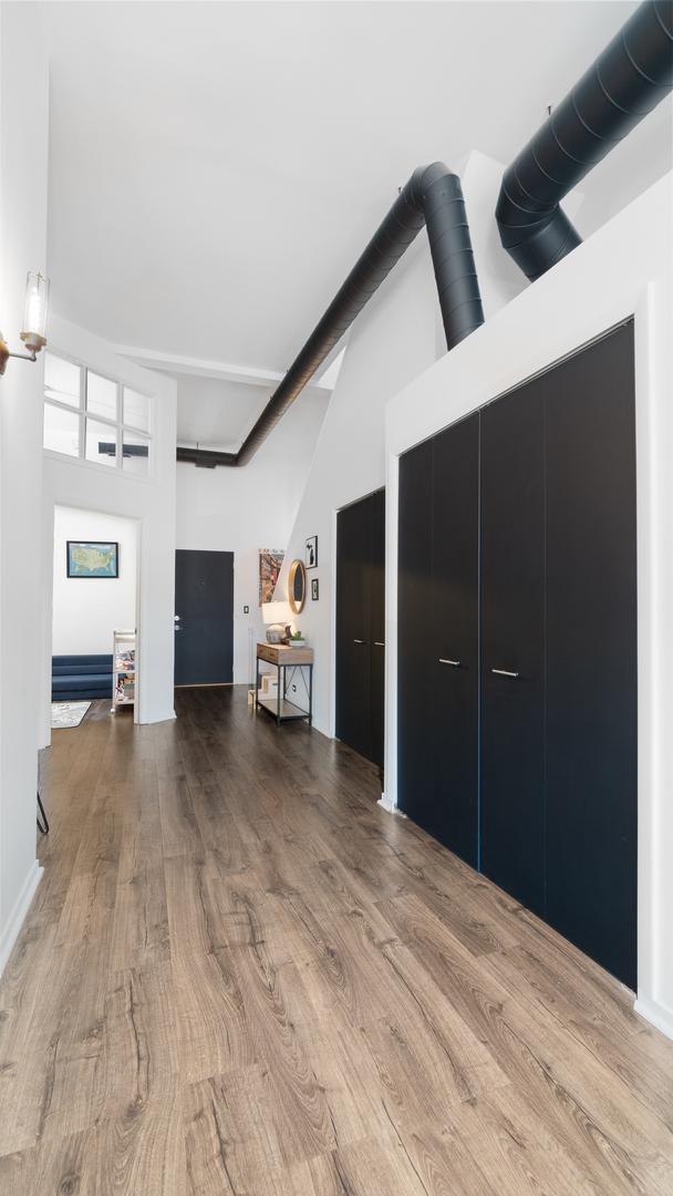 1760 W Wrightwood Ave Unit 305, Chicago, IL 60614 - living area featuring high vaulted ceiling and wood finished floors