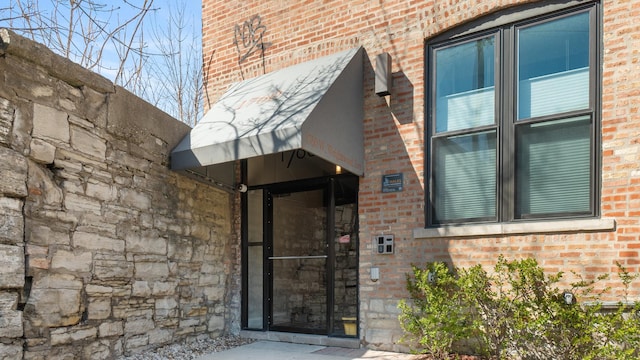 1760 W Wrightwood Ave Unit 305, Chicago, IL 60614 - view of exterior entry with brick siding