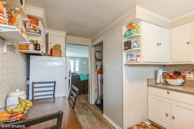 28 S Illinois Ave, Villa Park, IL 60181 - kitchen featuring wood finished floors, freestanding refrigerator, open shelves, and white cabinets