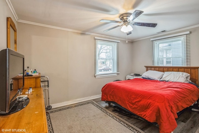 28 S Illinois Ave, Villa Park, IL 60181 - bedroom featuring crown molding, ceiling fan, visible vents, wood finished floors, and baseboards