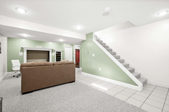 tiled living room with baseboards, recessed lighting, and stairway