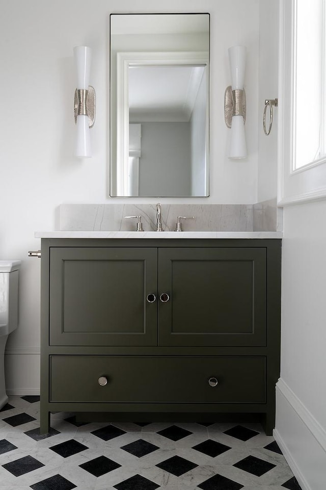 bathroom with tile patterned floors and vanity