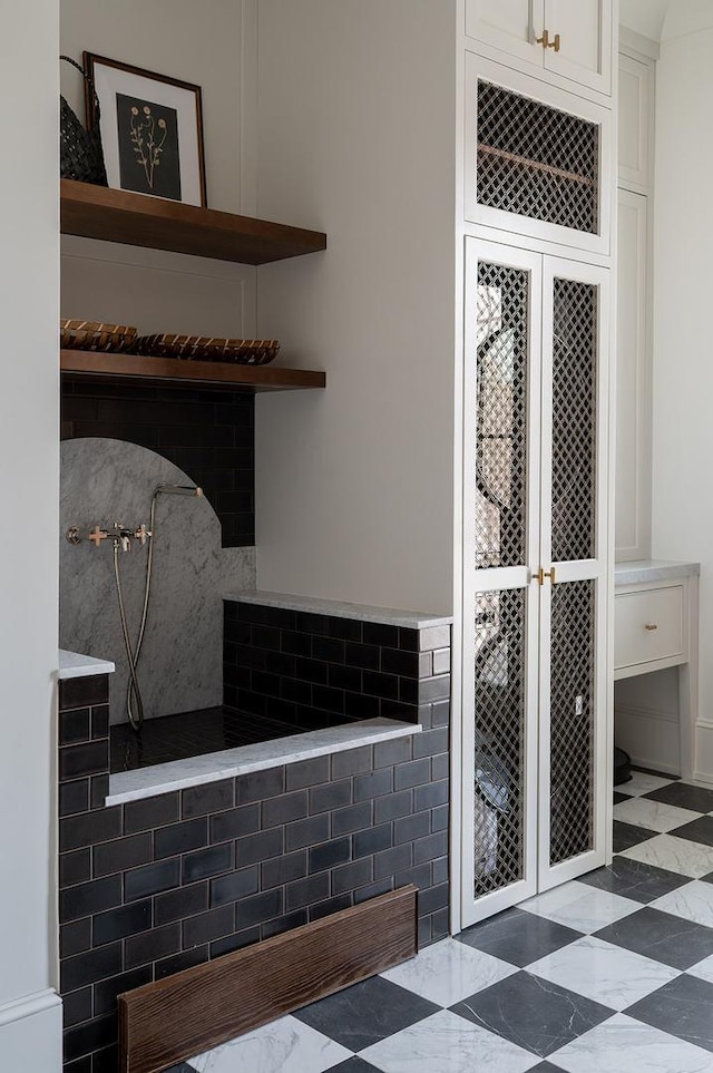 full bathroom with tile patterned floors and a walk in shower