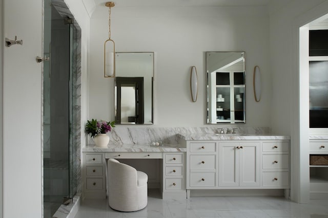 full bath with vanity, marble finish floor, and a stall shower
