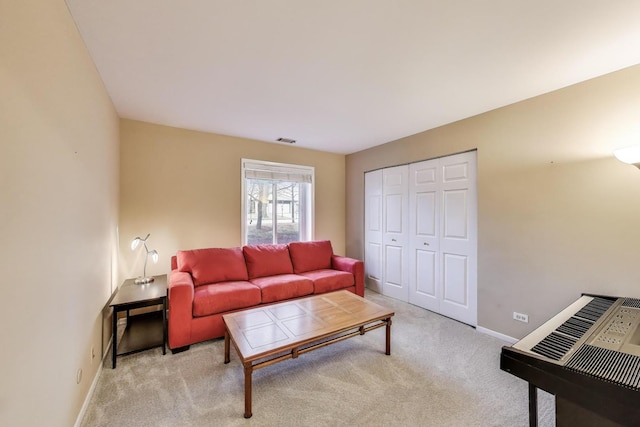 living room featuring baseboards and carpet floors