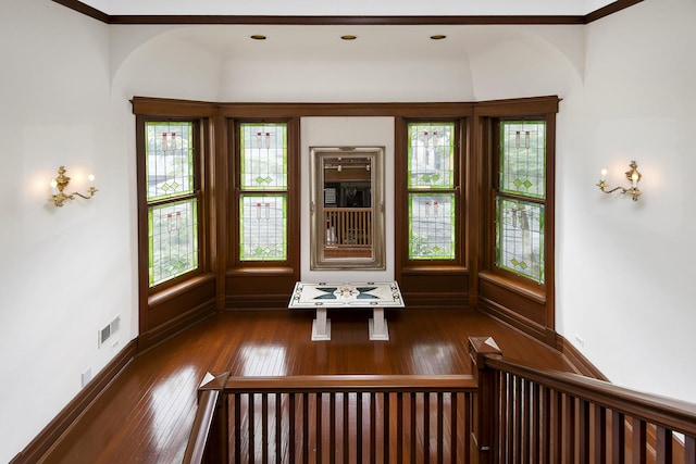 interior space with baseboards and hardwood / wood-style floors
