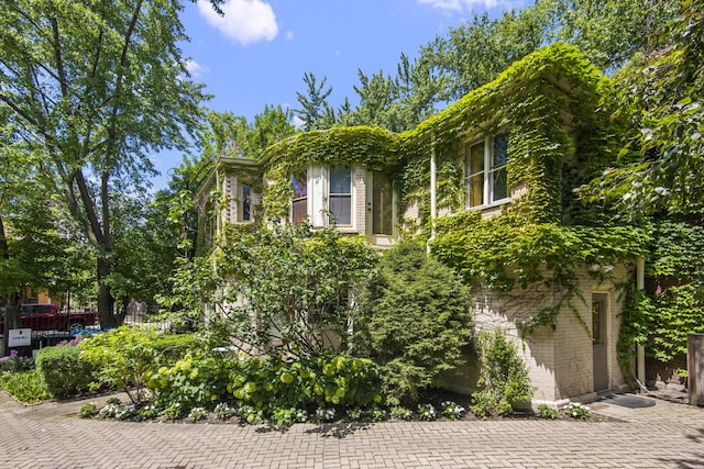 view of home's exterior featuring fence