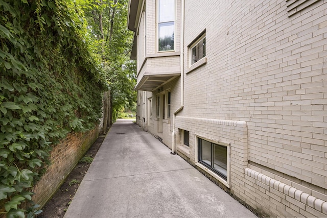 view of side of property featuring brick siding